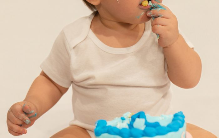 Baby Jet eating a cake healthy and happy after receiving his donor milk