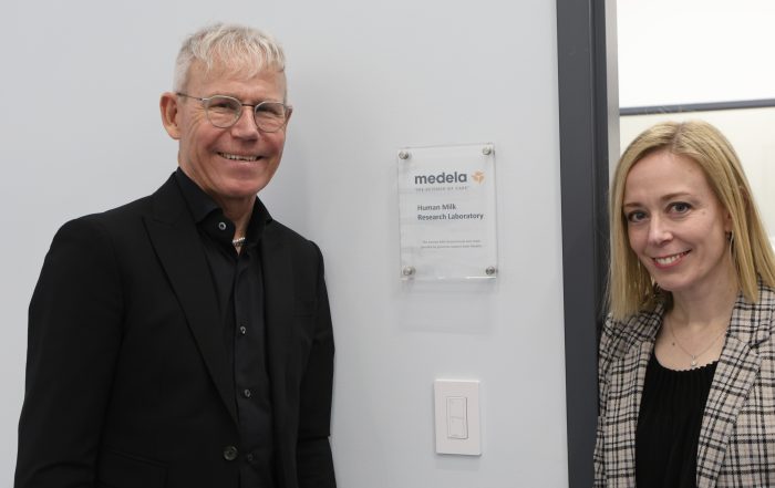 Michael Larsson Medela Chairman of the Board and Summer Kelly Executive Director of Mothers' Milk Bank of the Western Great Lakes Celebrating the Medela Research Lab