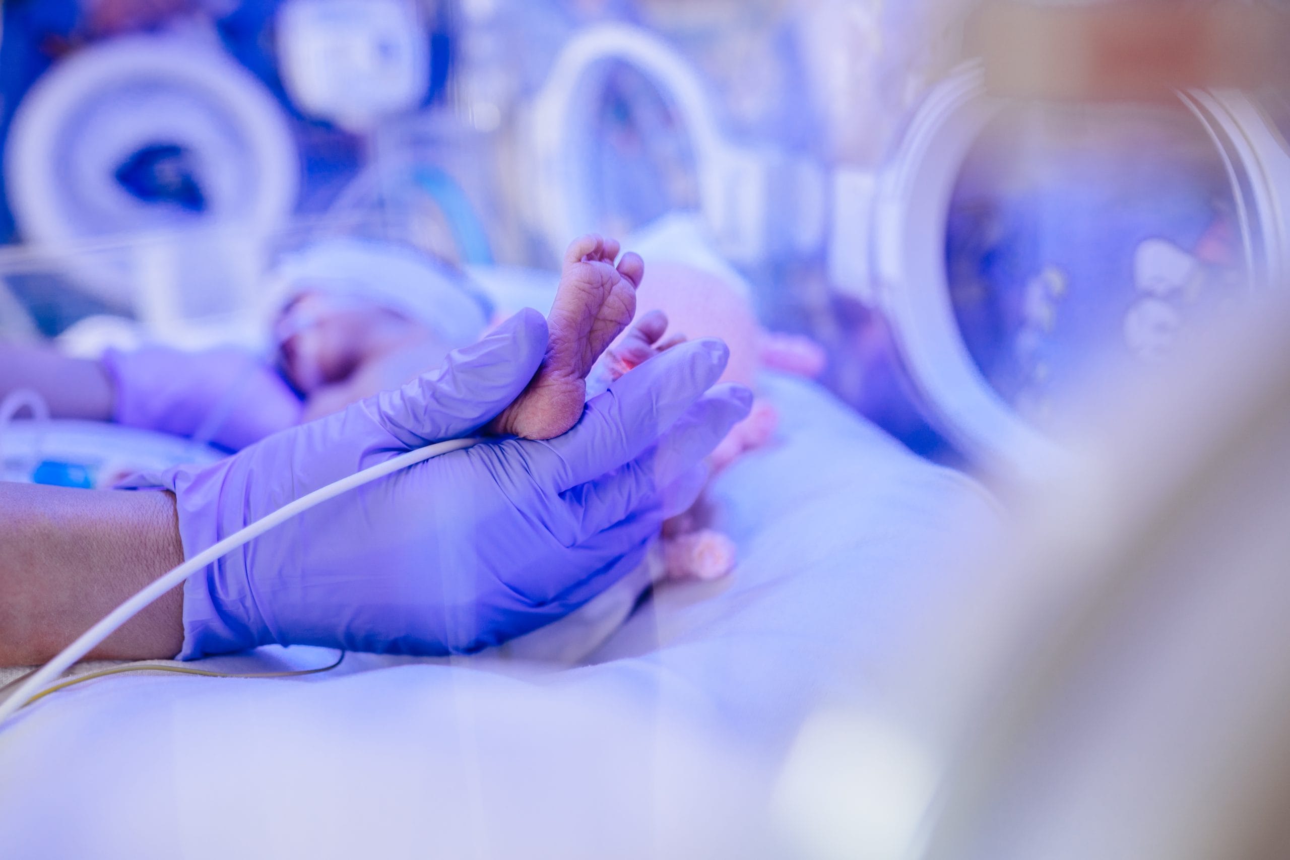 Doctor’s hand and legs of a child. Doctor's hand and legs of a child.