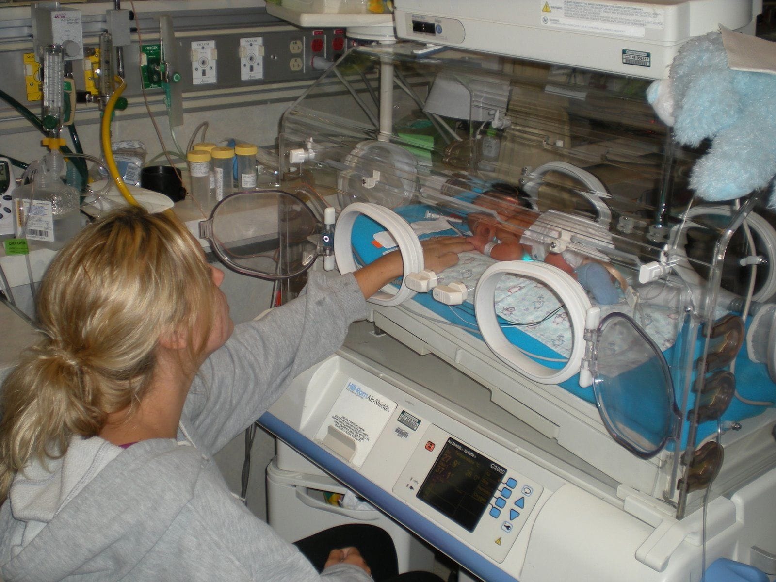 Mother with her newborn baby in NICU Mother with her newborn baby in NICU
