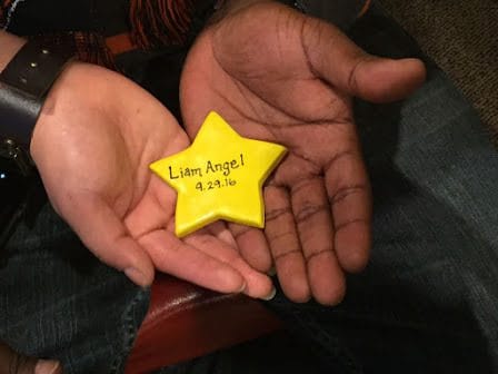 Hand holding star with birthday